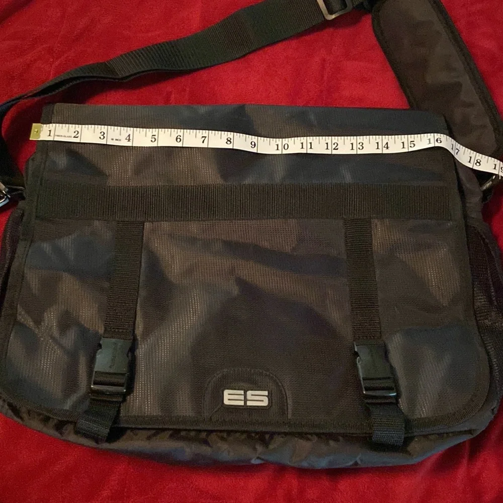 Messenger bag features laptop sleeve- multi- function pockets— Adjustable strap